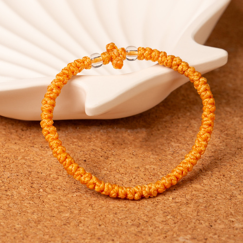 Браслет плетеный (комбоскини) с пластиковыми бусинами, желтый фото 2