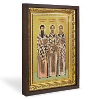 Икона святителей Василия Великого, Григория Богослова и Иоанна Златоуста, в широком багете, цвет "темный дуб", на холсте, с золочением